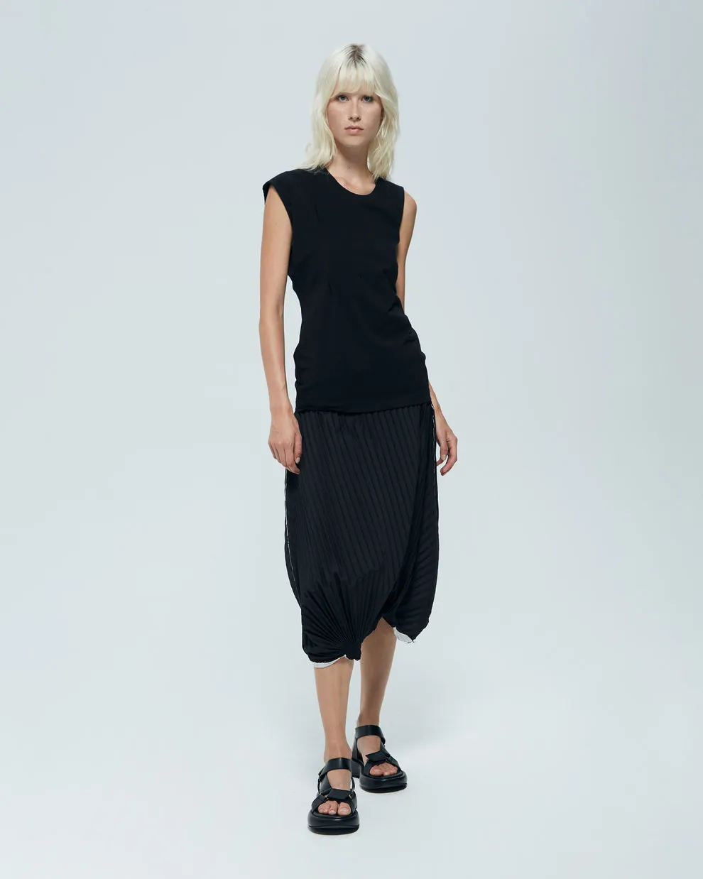 Asymmetric pleated skirt