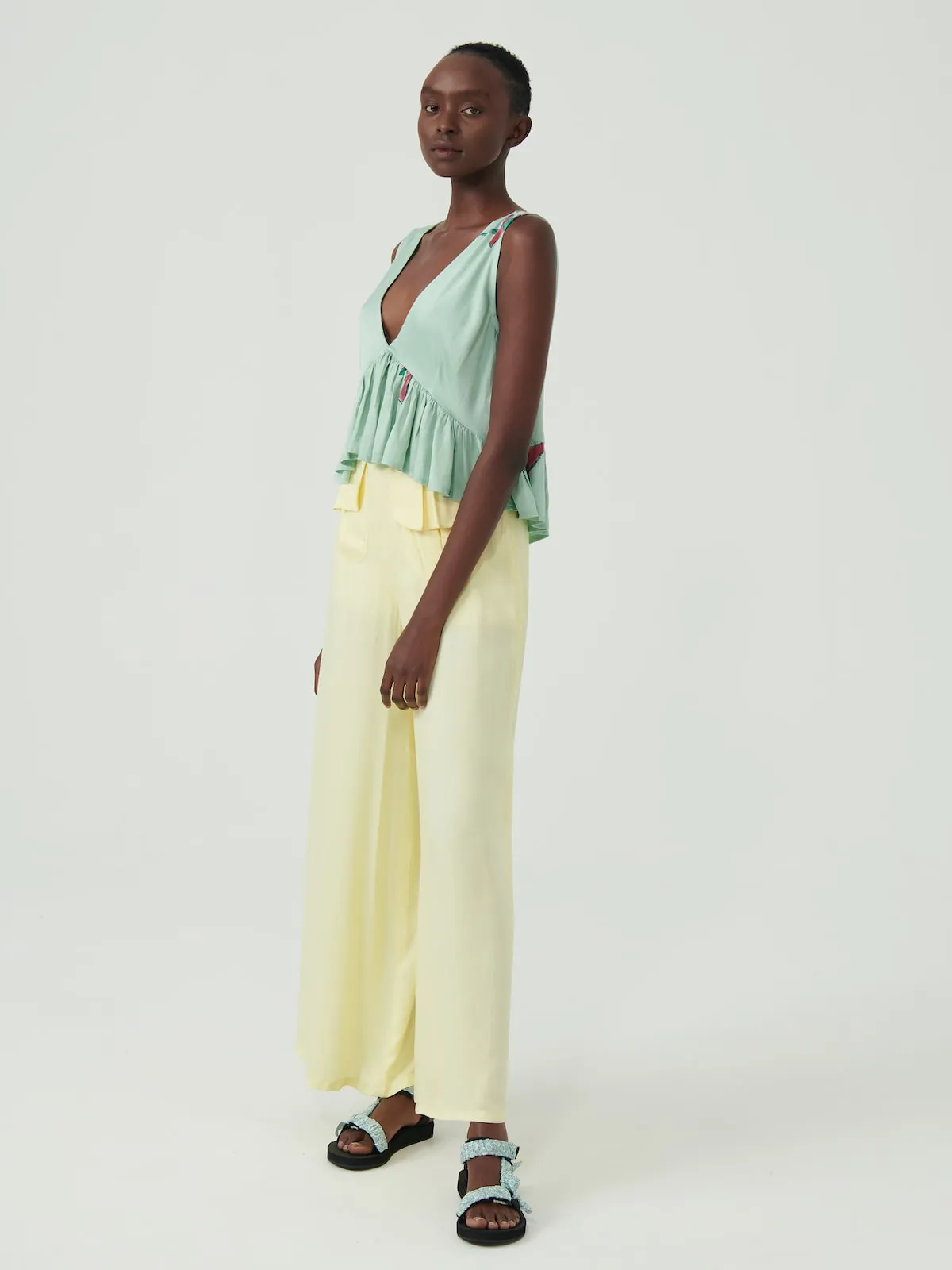 Bee Eater Sleeveless Peplum Top